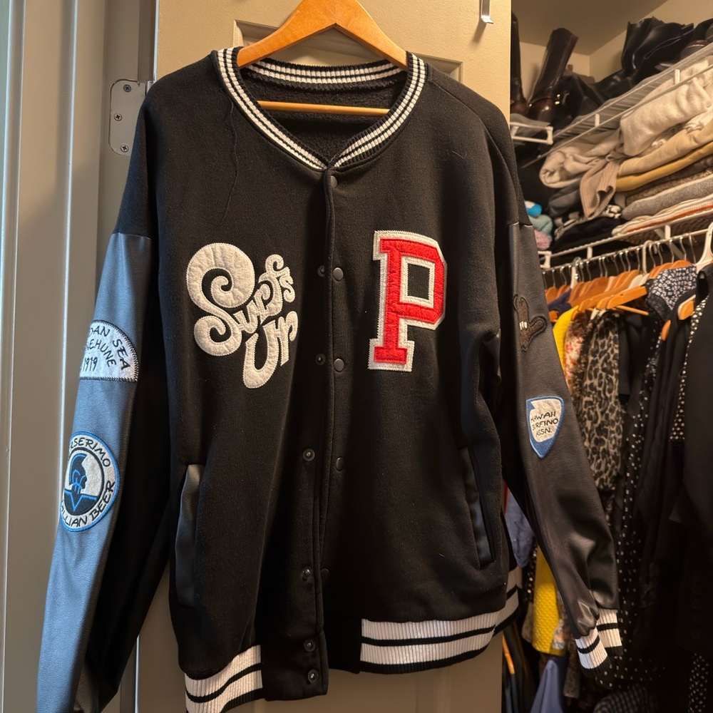 Black Jacket with Red and Blue Patches